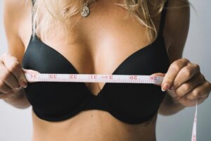 woman measuring her breast